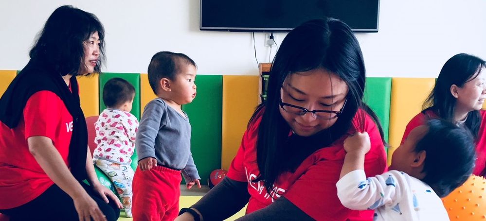 Veritas HR volunteers getting to know patients at Beijing's Chun Miao Children Base, a local medical center dedicated to the care of children.