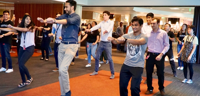 Veritas University interns dance during the Intern Summit Week celebration.