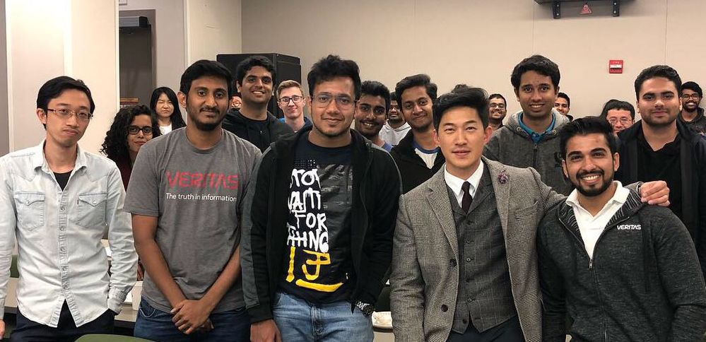 Yoon Chung, Veritas CX Director of Program Management, shares a photo opportunity with students attending the Veritas Technologies information sessions.