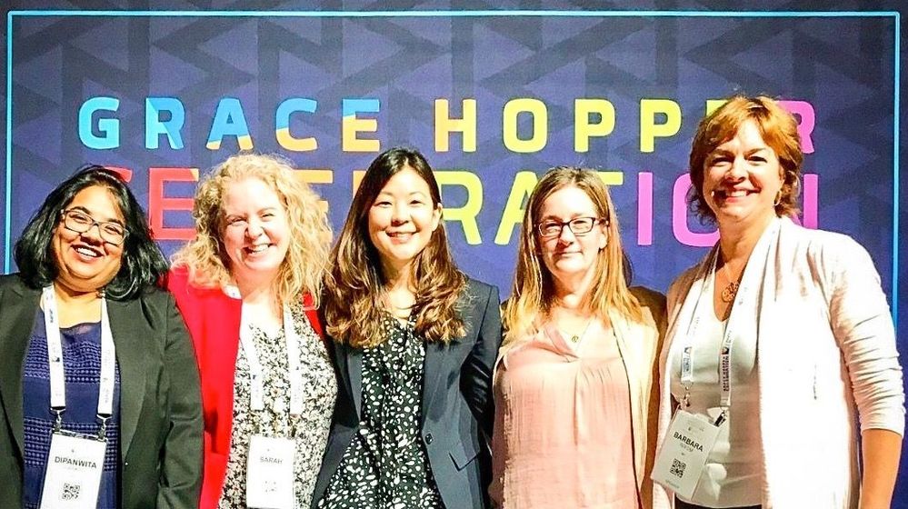 Members of #TeamVtas gather for a group photo at this year's Grace Hopper Conference, including presenter, Veritas Director of Finance, Sarah Byrne, second from left..