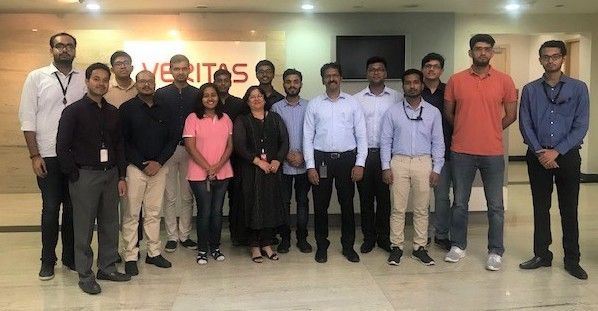 The group joins to take a photo together following a day of networking at Veritas India.