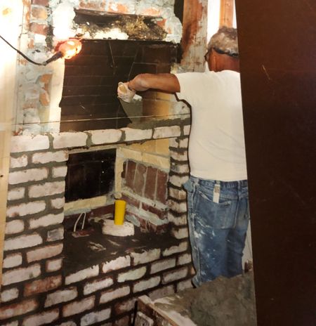 Lenny Alugas Dad laying bricks smaller version.jpg